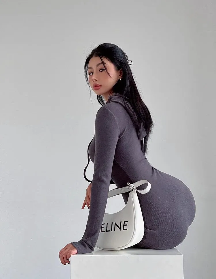 Women's light gray hooded sheath dress with long sleeves and a high waist on a hanger