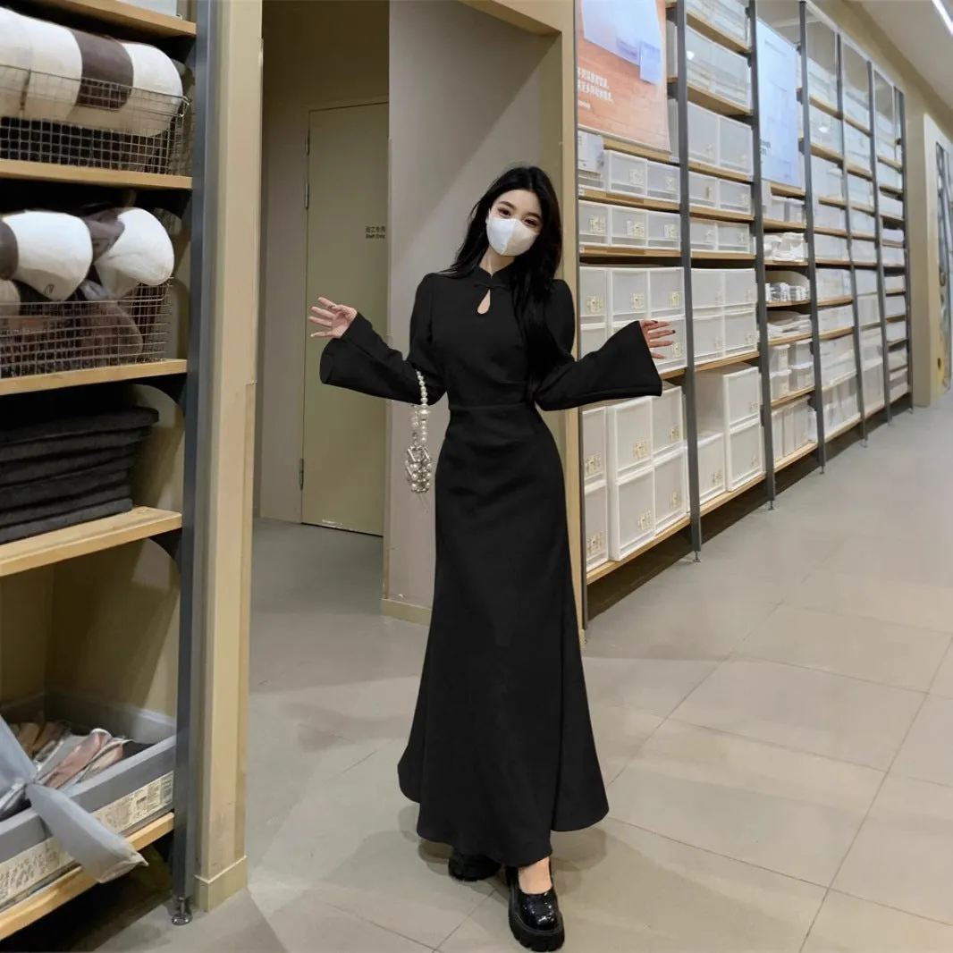 Plus size cheongsam dress in black with waist-tight draping, long sleeves, and long skirt