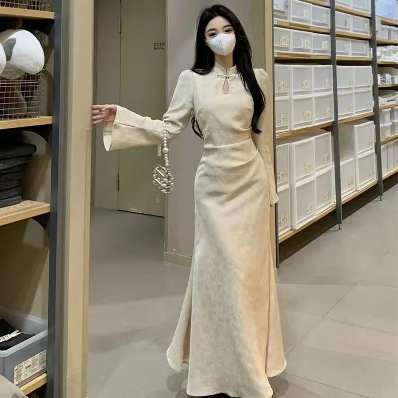 Plus size cheongsam dress in black with waist-tight draping, long sleeves, and long skirt