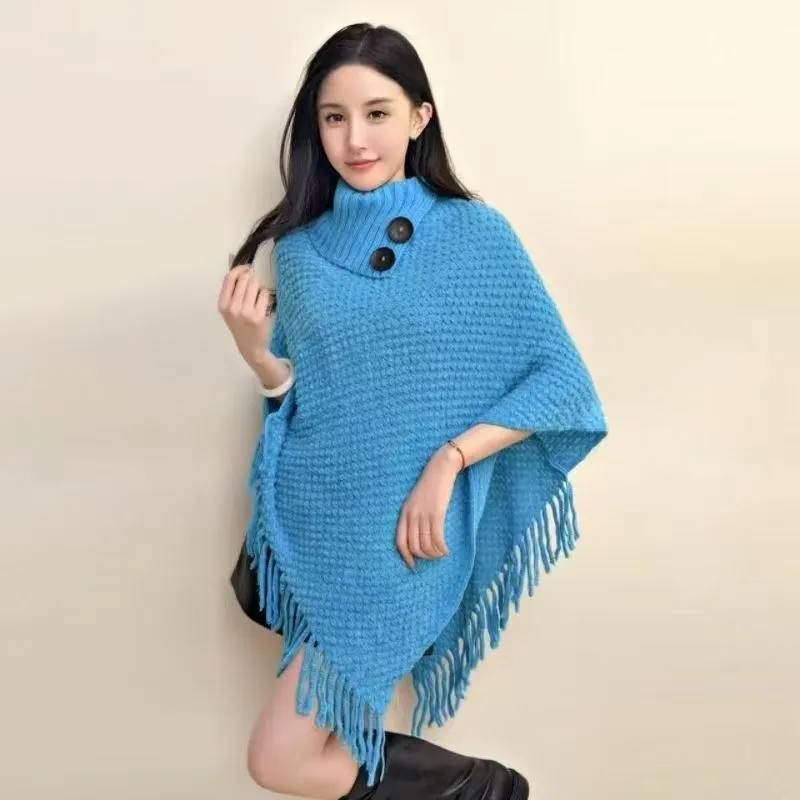 Women's plush triangle shawl cape in a cashmere blend with tassel detailing, shown in wine red.