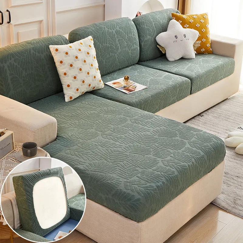 Nordic stretch sofa cover with Japanese banana leaf print in Lake Blue, fitted on a single cushion
