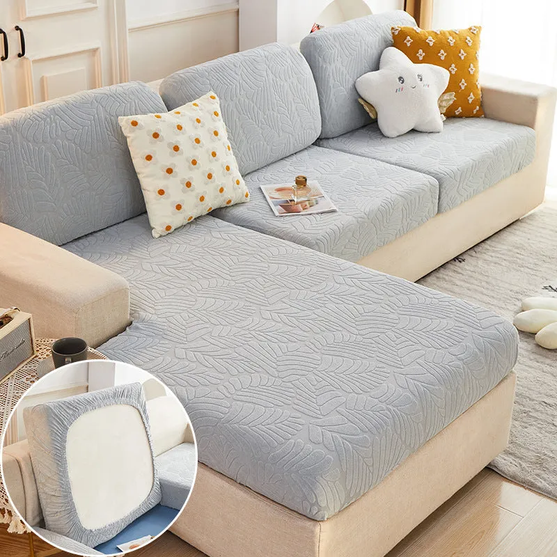 Nordic stretch sofa cover with Japanese banana leaf print in Lake Blue, fitted on a single cushion