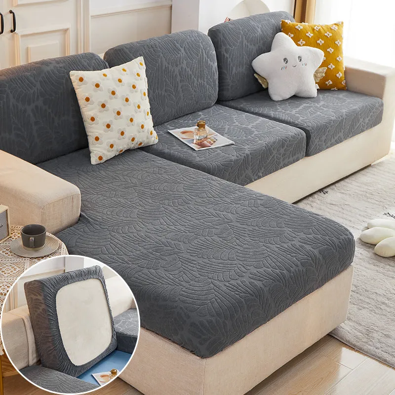 Nordic stretch sofa cover with Japanese banana leaf print in Lake Blue, fitted on a single cushion