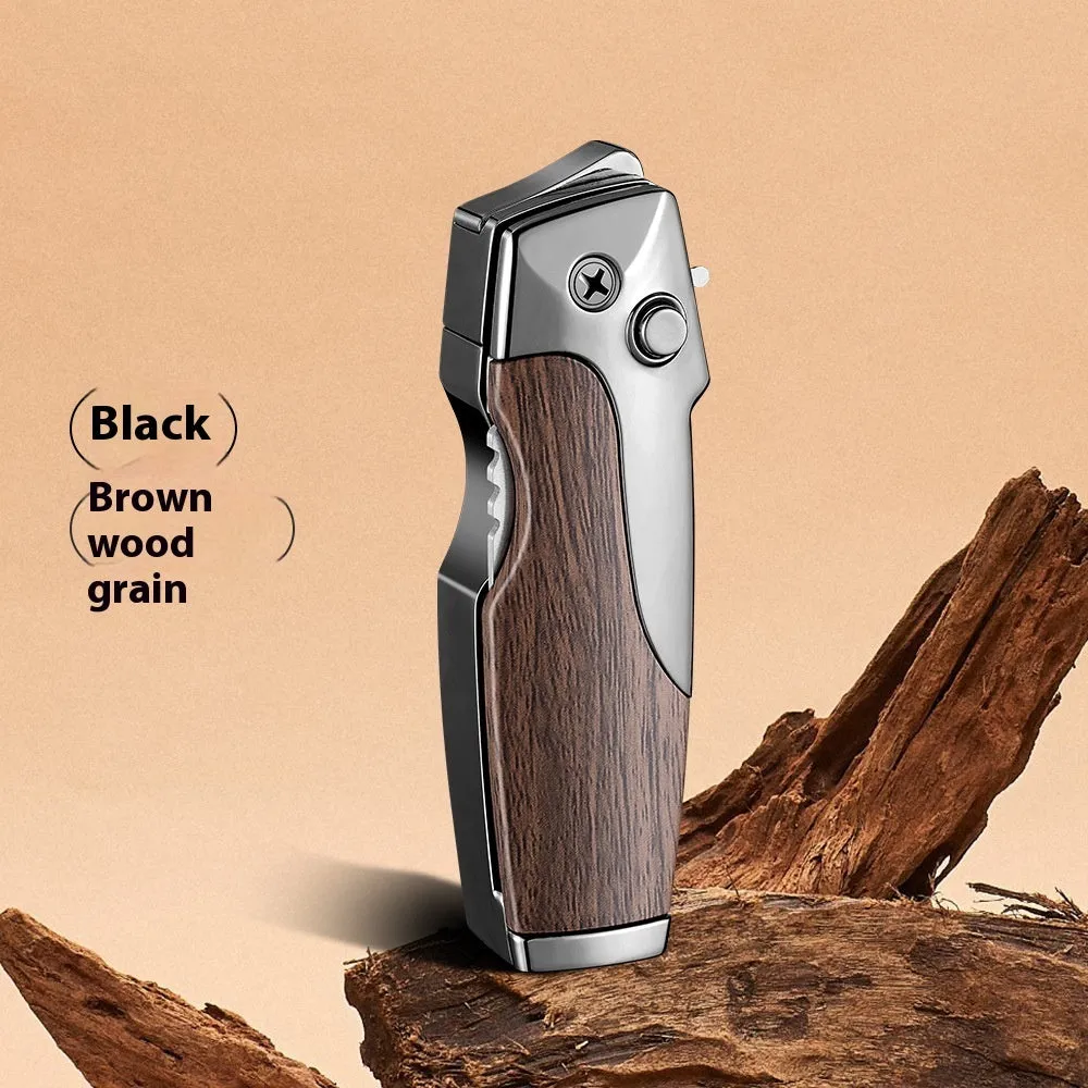 Closed metal folding lighter with integrated knife in a carbon fibre finish, showing the safety lock and refill valve.
