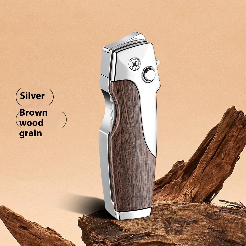 Closed metal folding lighter with integrated knife in a carbon fibre finish, showing the safety lock and refill valve.