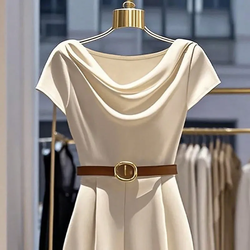 Apricot satin wide-leg jumpsuit with mid-waist and quarter sleeves on a model