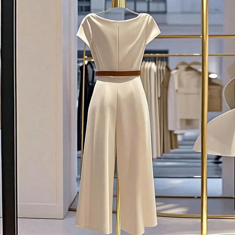 Apricot satin wide-leg jumpsuit with mid-waist and quarter sleeves on a model