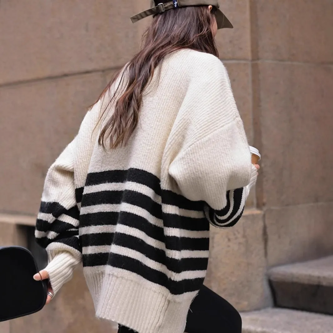Beige loose maternity sweater with stand collar and long sleeves on a plain background