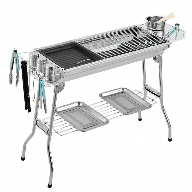 Stainless steel portable barbecue oven with charcoal grill and cooking accessories