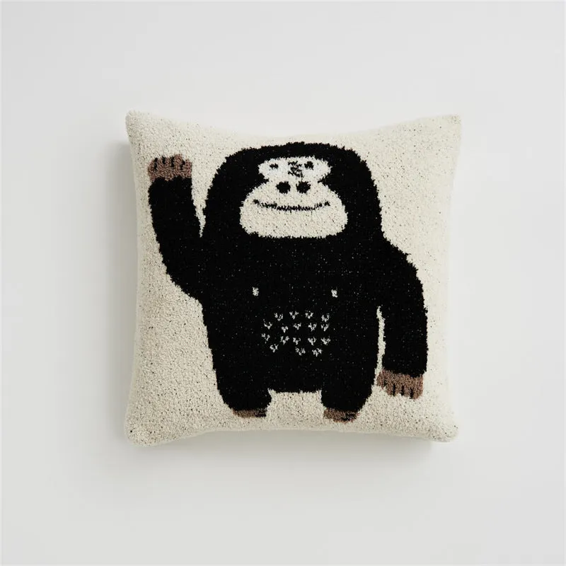 Cartoon anime knitted velvet pillowcase in black big face design on a bed