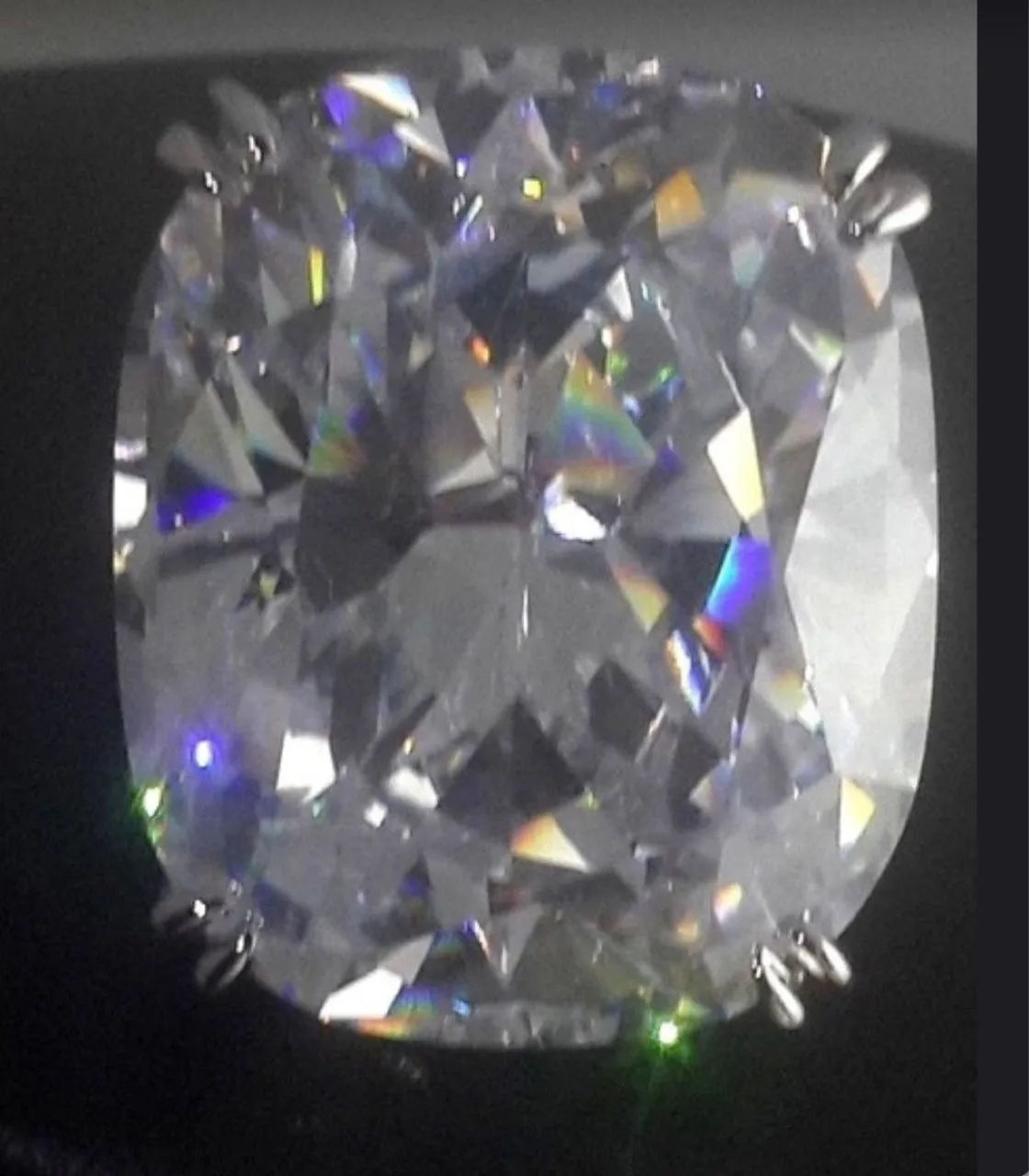 Women's square diamond ring with electroplated white gold colour and geometric design showing inlaid white stones