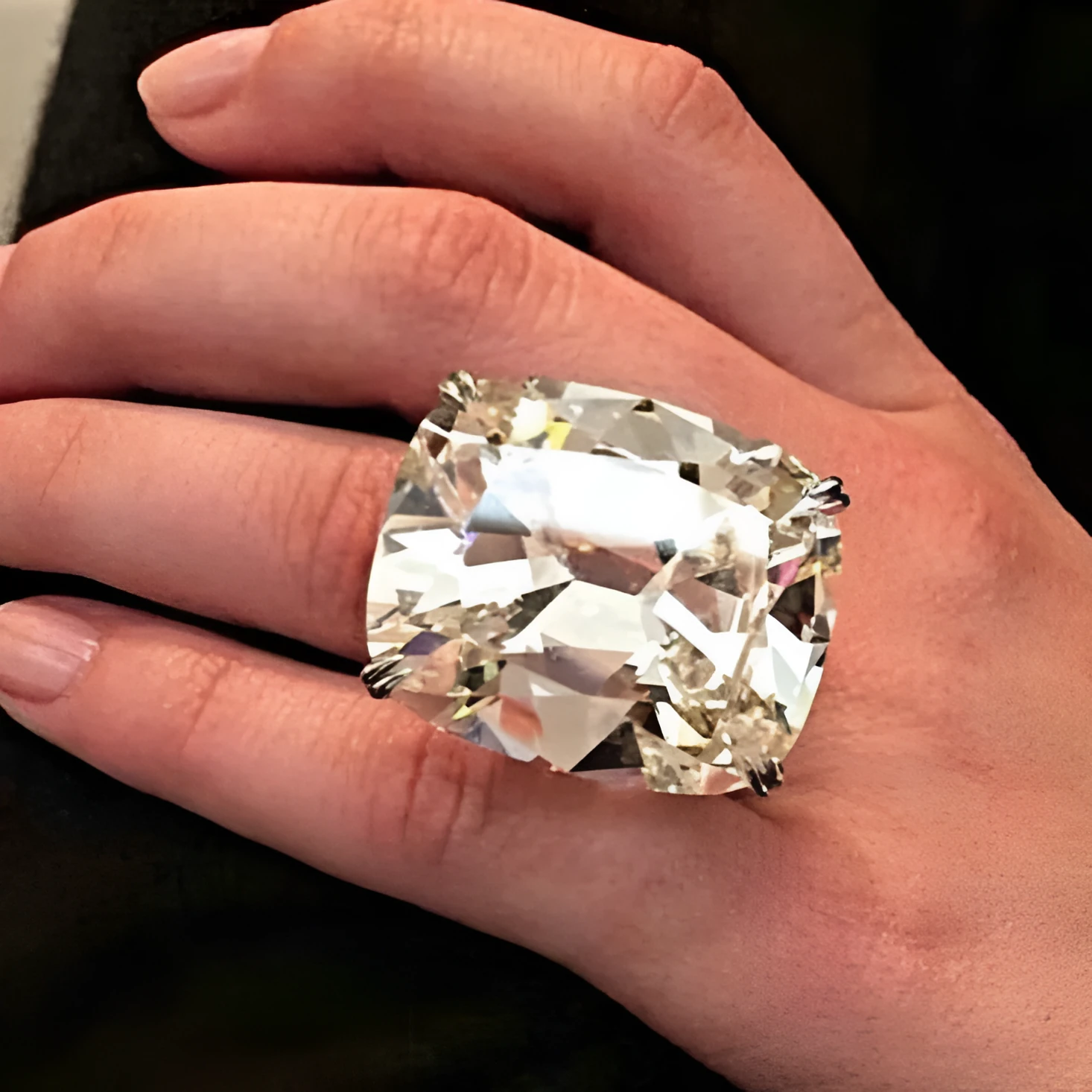 Women's square diamond ring with electroplated white gold colour and geometric design showing inlaid white stones