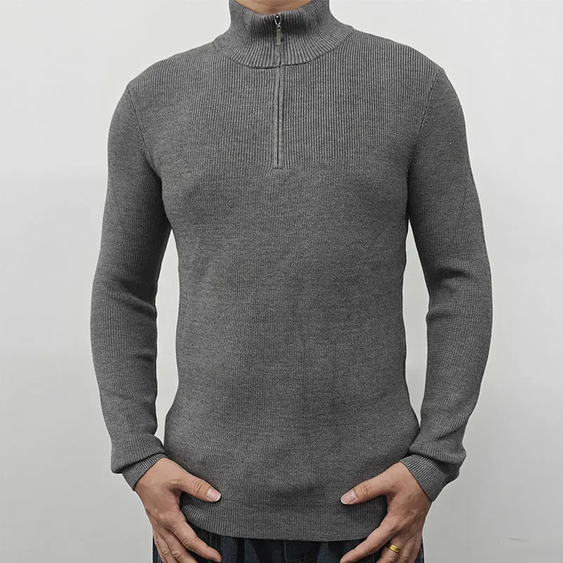 Men's black half-turtleneck zip sweater on a hanger, showing long sleeves and zip front detail.