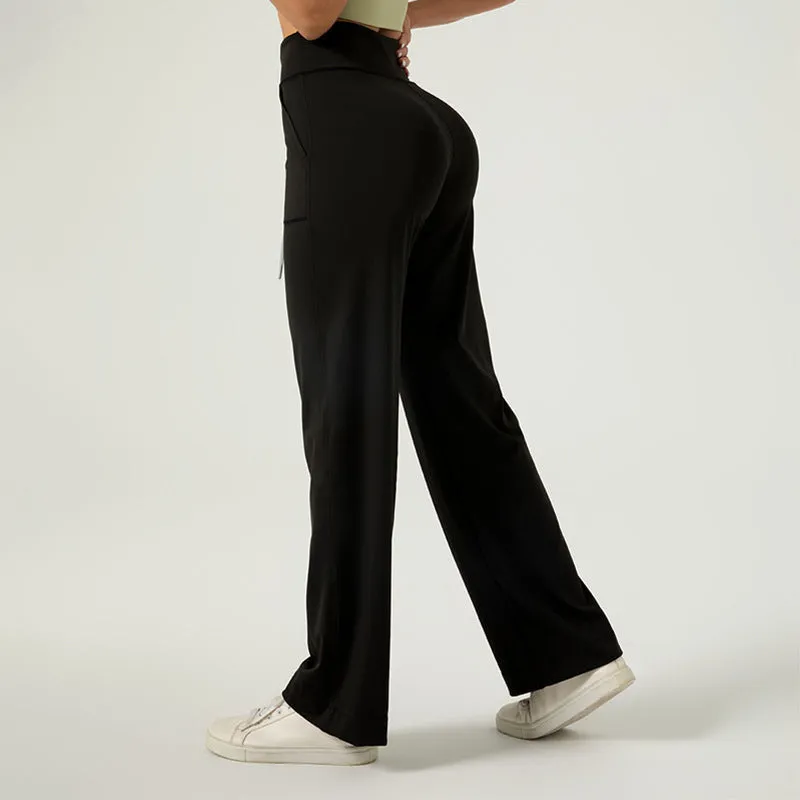 Women's high waist loose fit drawstring sports trousers in Star Black, side view, with elastic waistband and straight leg.