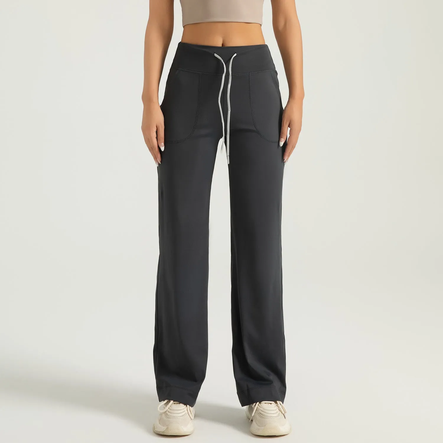 Women's high waist loose fit drawstring sports trousers in Star Black, side view, with elastic waistband and straight leg.