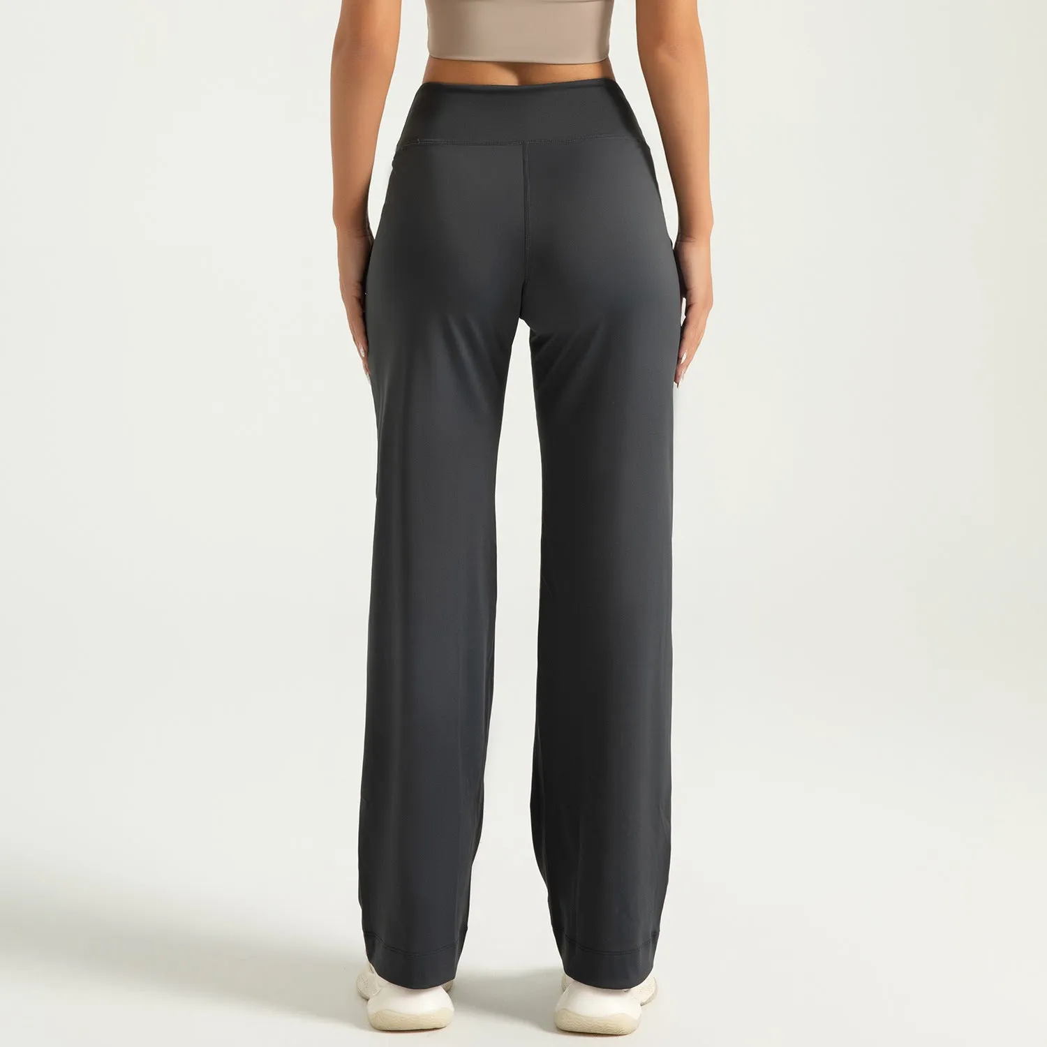 Women's high waist loose fit drawstring sports trousers in Star Black, side view, with elastic waistband and straight leg.