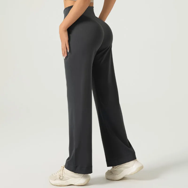 Women's high waist loose fit drawstring sports trousers in Star Black, side view, with elastic waistband and straight leg.