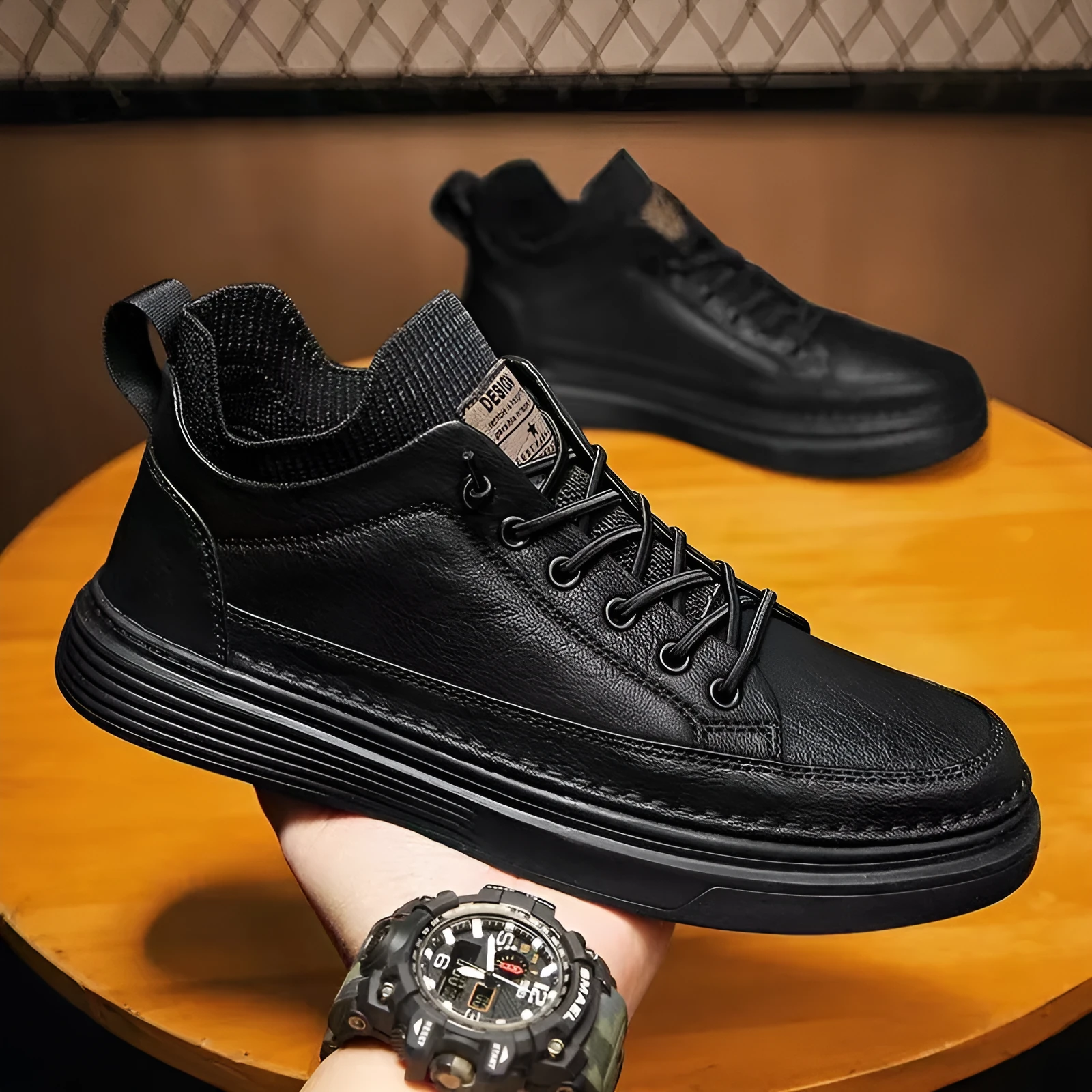 Men's black non-slip lightweight EVA sole sneakers with round toe and laces on plain background