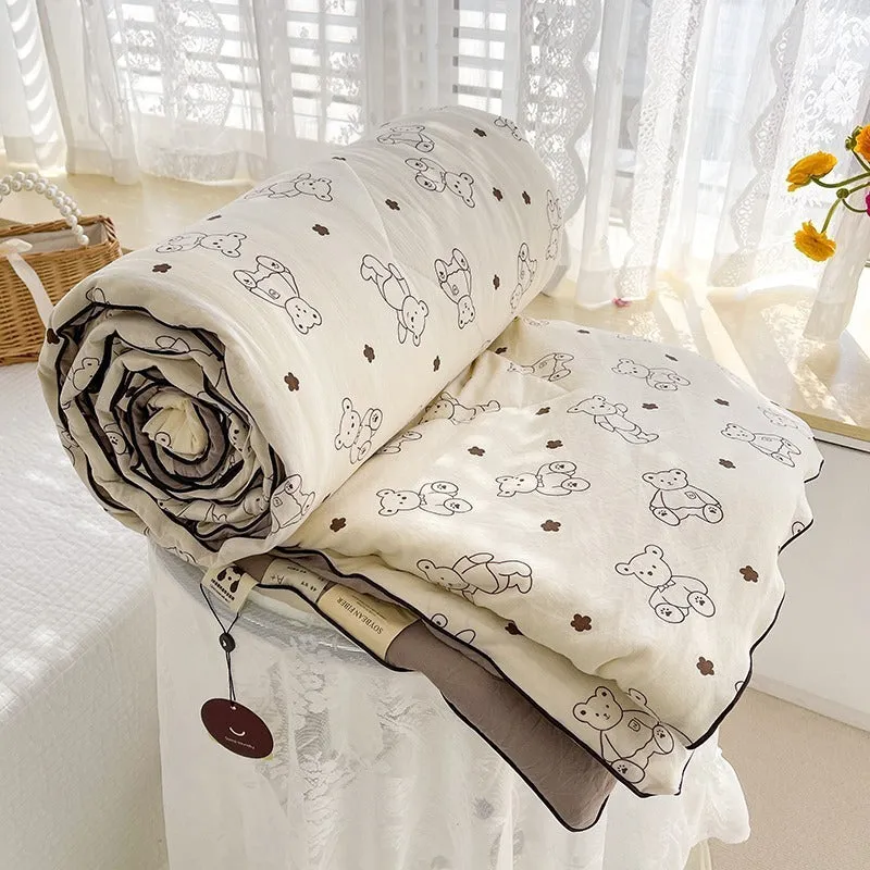 Class A washed cotton double-layer yarn soybean fiber summer quilt with blossom pattern on a light background