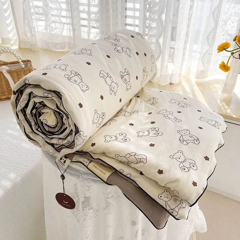 Class A washed cotton double-layer yarn soybean fiber summer quilt with blossom pattern on a light background