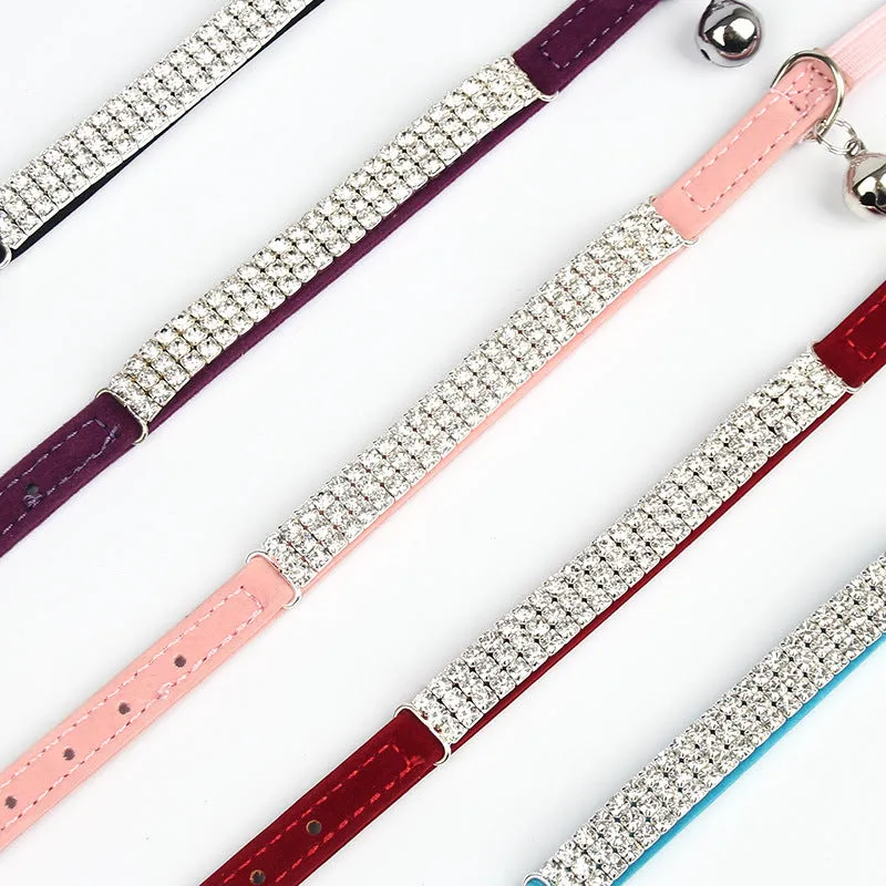 Red velvet suede cat collar with a central silver rhinestone, showing adjustable buckle on a 1cm wide band.