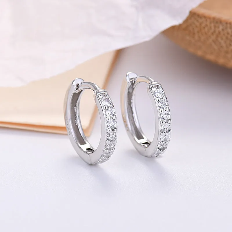 Gang Drill Zircon stud earrings in silver with geometric starry sky design, unisex style
