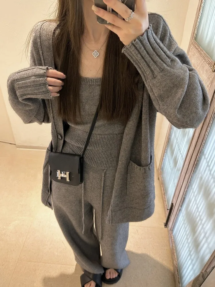 Women's light brown knit cardigan, vest, and casual pants three-piece set laid flat.