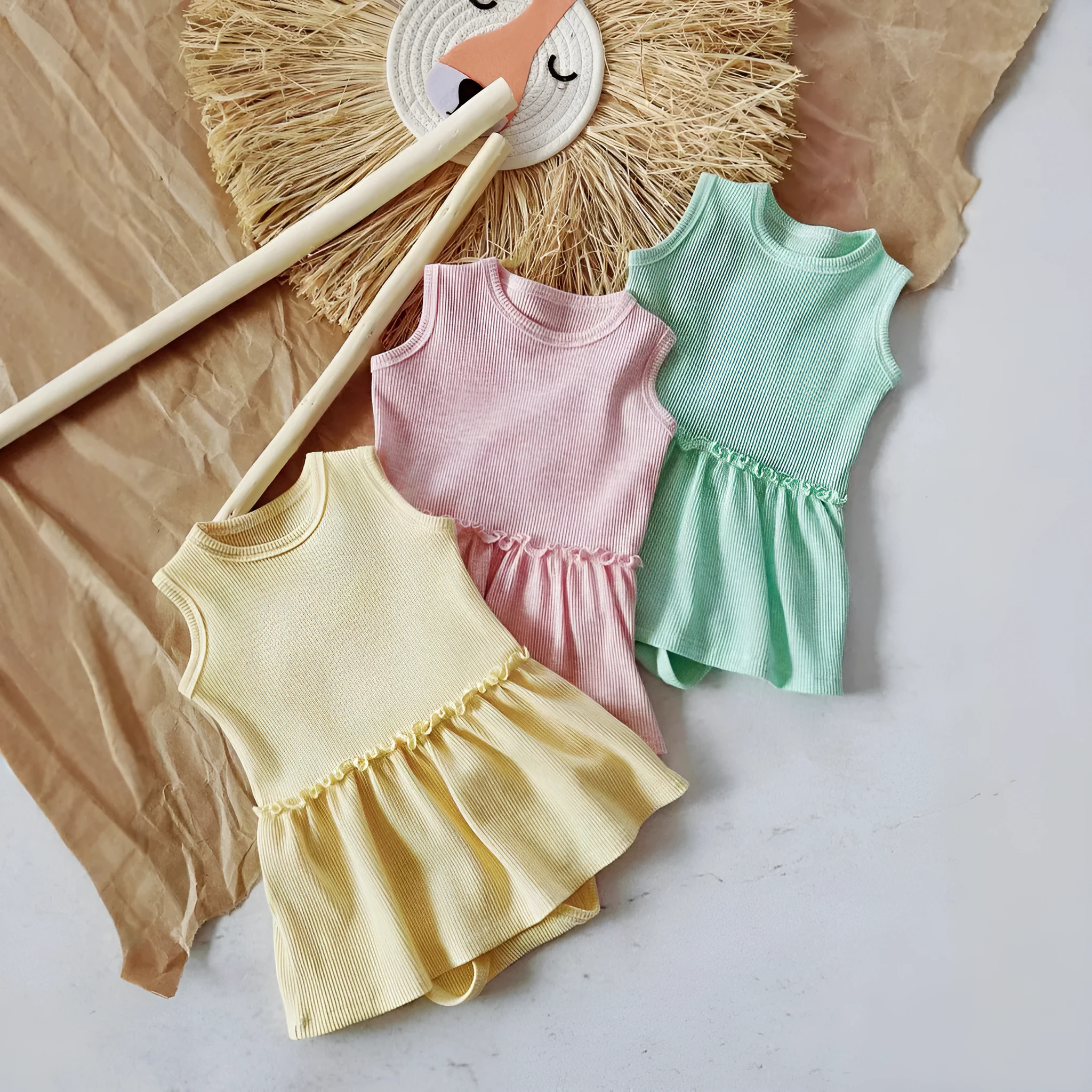 Baby girl sleeveless cotton waffle vest onesie in triangle jumpsuit style, three colour options available