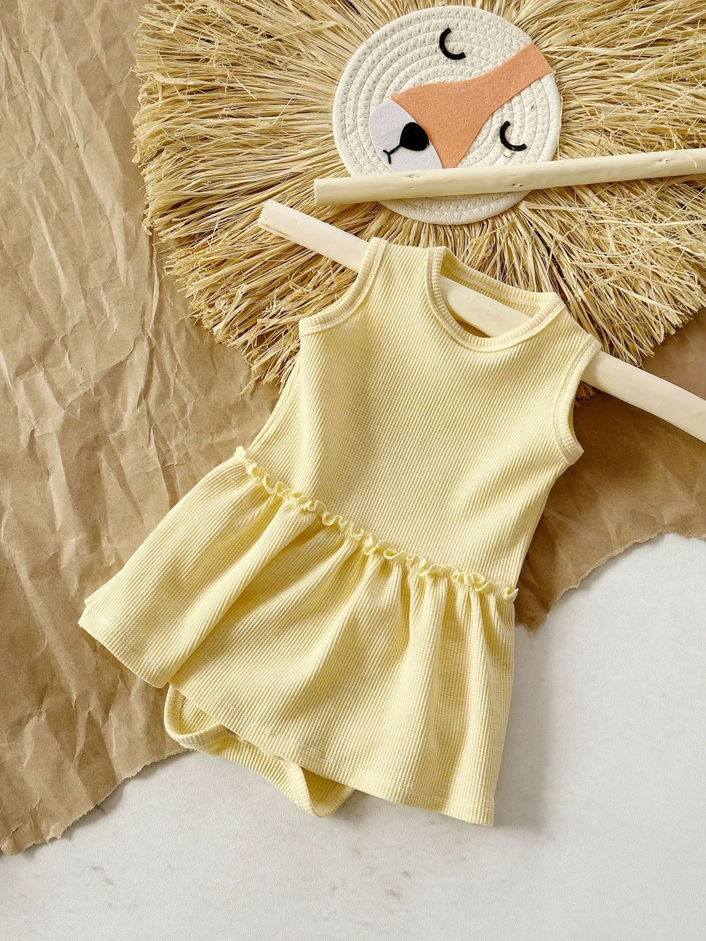 Baby girl sleeveless cotton waffle vest onesie in triangle jumpsuit style, three colour options available