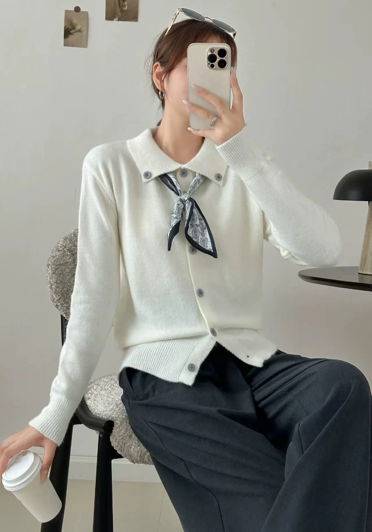 Beige lapel scarf style acrylic cardigan sweater with long sleeves and splicing detail.