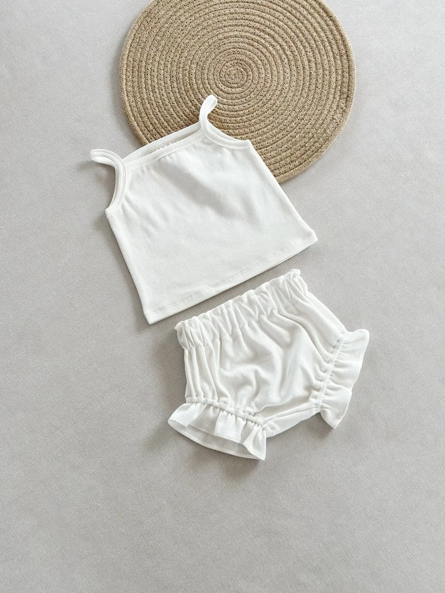 Women's cotton rib home wear two-piece set with sleeveless top and shorts in rose colour on white background