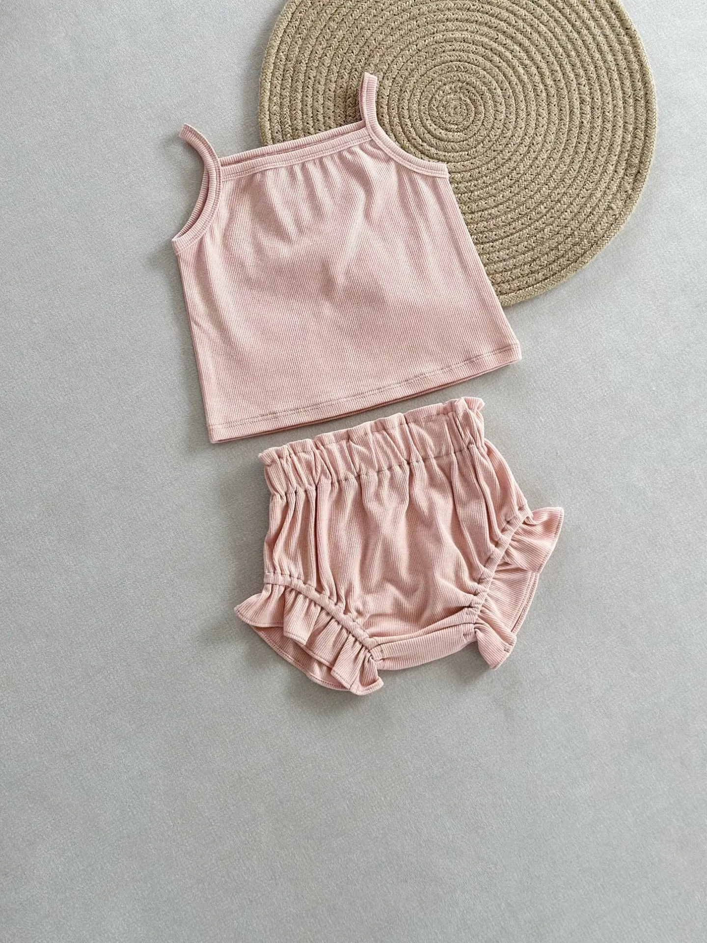 Women's cotton rib home wear two-piece set with sleeveless top and shorts in rose colour on white background
