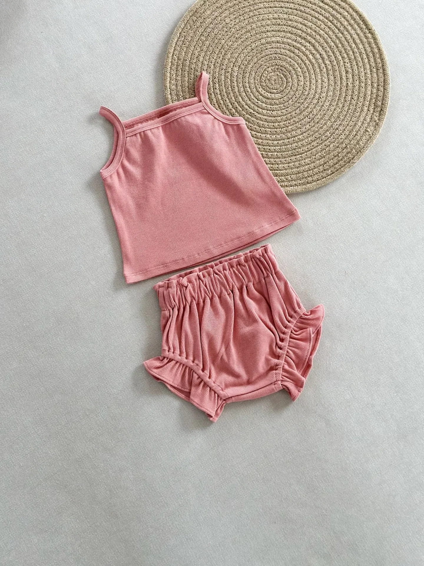 Women's cotton rib home wear two-piece set with sleeveless top and shorts in rose colour on white background