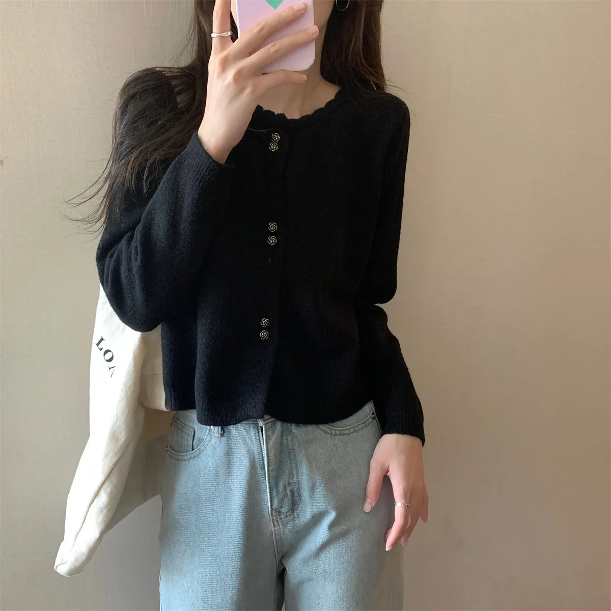 Women's milky white acrylic long-sleeved cardigan coat worn open, showing regular fit and free size.