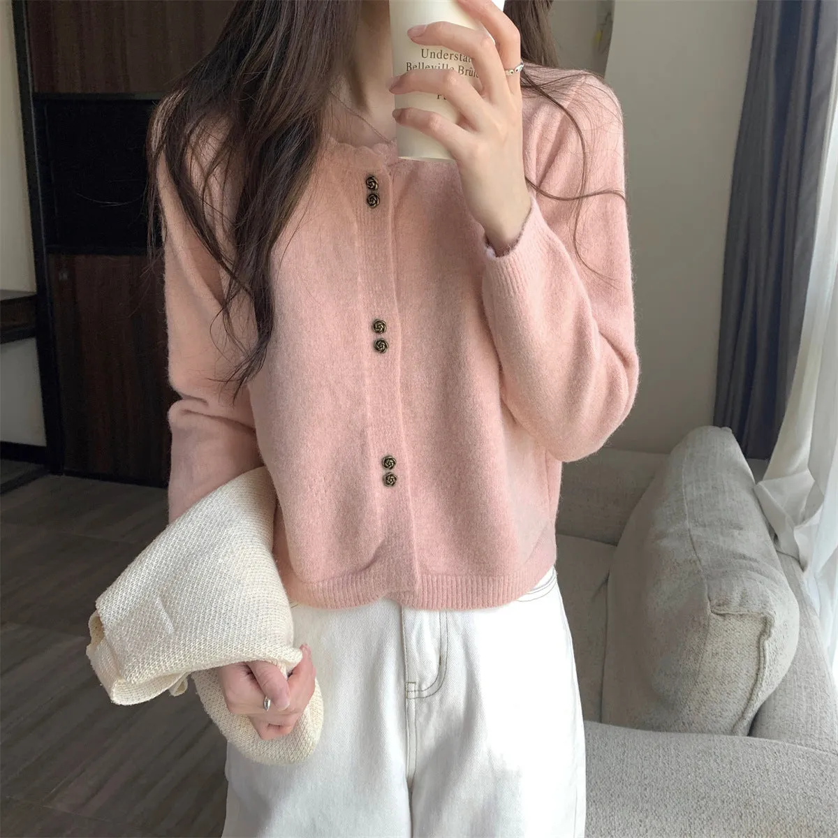 Women's milky white acrylic long-sleeved cardigan coat worn open, showing regular fit and free size.