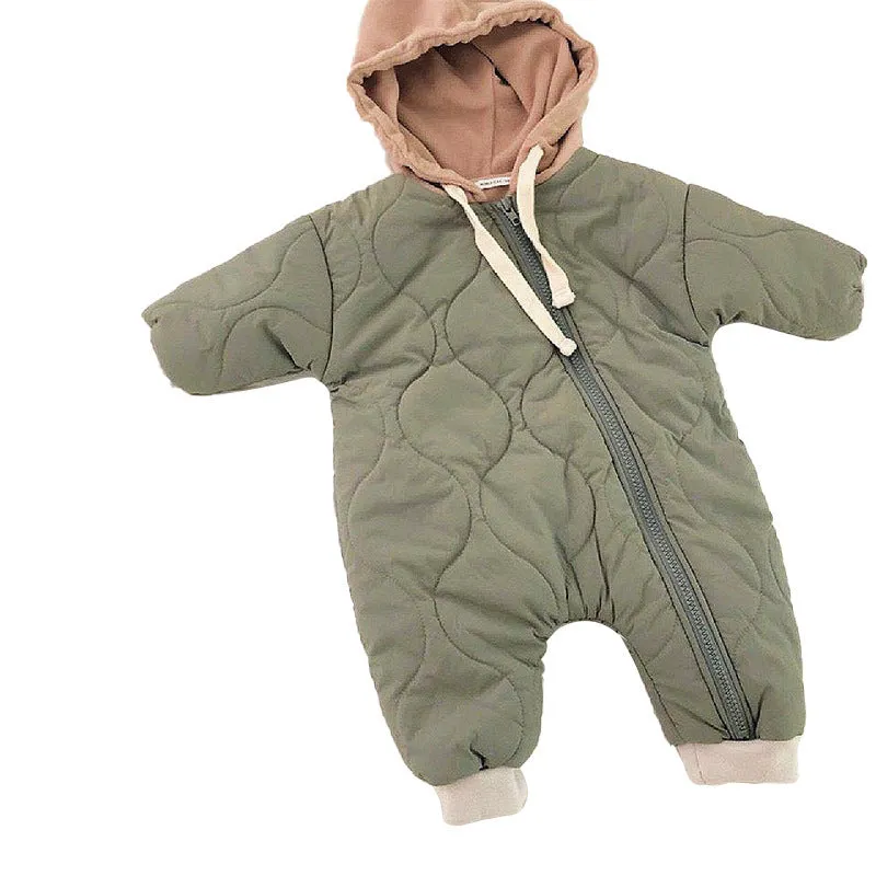 Baby padded quilted cotton kumpsuit in beige with attached hat and long sleeves, shown on a white background