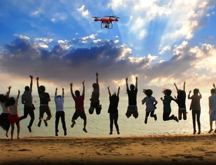 X52 RC quadcopter drone with 1080P camera, black fuselage, and four rotor arms on a white background