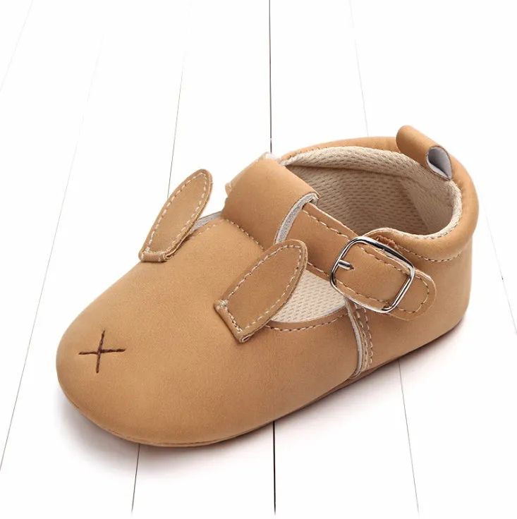 Spring autumn cartoon animal baby shoes in beige panda design with matte nubuck leather upper and soft non-slip sole.