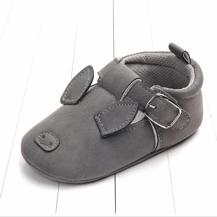 Spring autumn cartoon animal baby shoes in beige panda design with matte nubuck leather upper and soft non-slip sole.