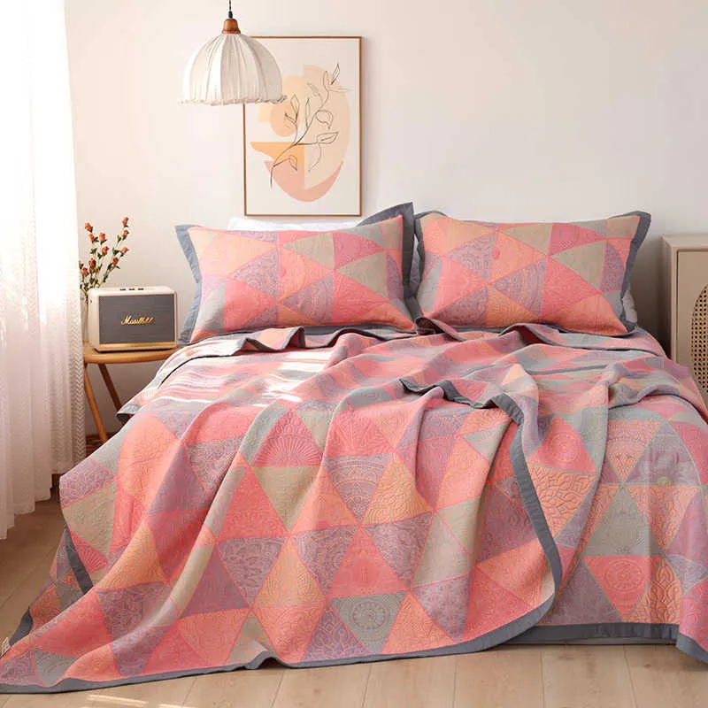Three-piece cotton gauze bed blanket set with floral pattern showing blanket and two pillowcases