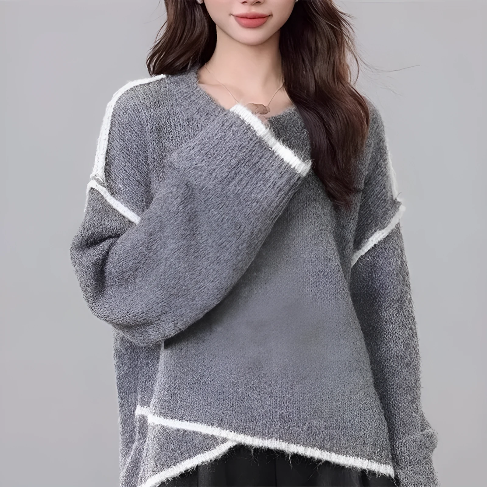 Women's idle style gray cotton loose pullover sweater on a plain background