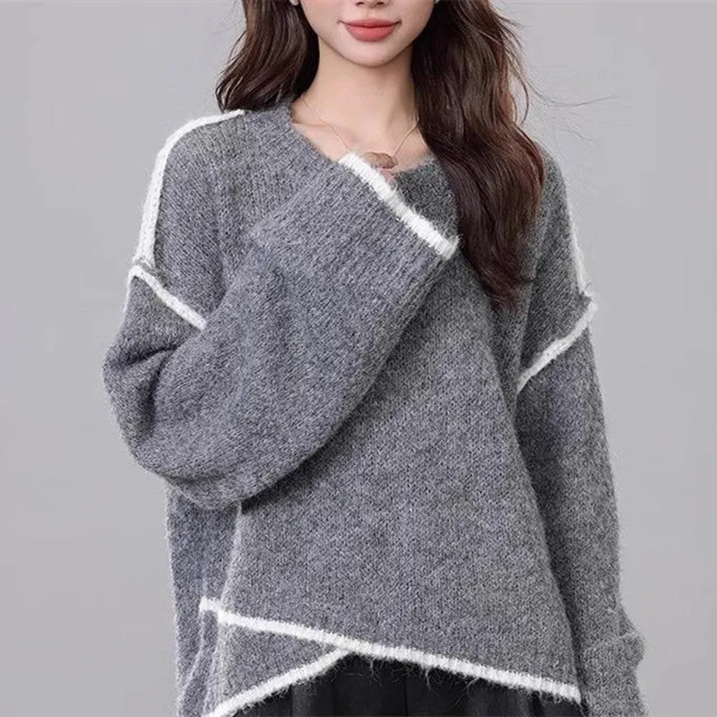 Women's idle style gray cotton loose pullover sweater on a plain background