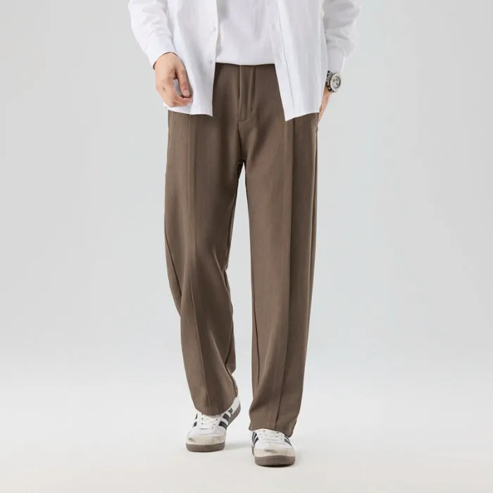 Men's casual loose straight-leg pants in solid colour with mid-high elastic waist and button fly front, available in plus sizes
