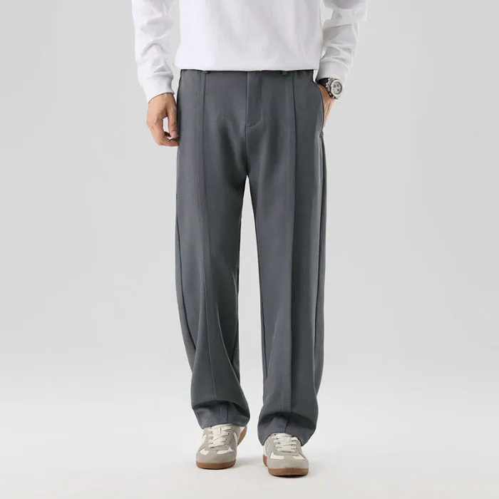 Men's casual loose straight-leg pants in solid colour with mid-high elastic waist and button fly front, available in plus sizes