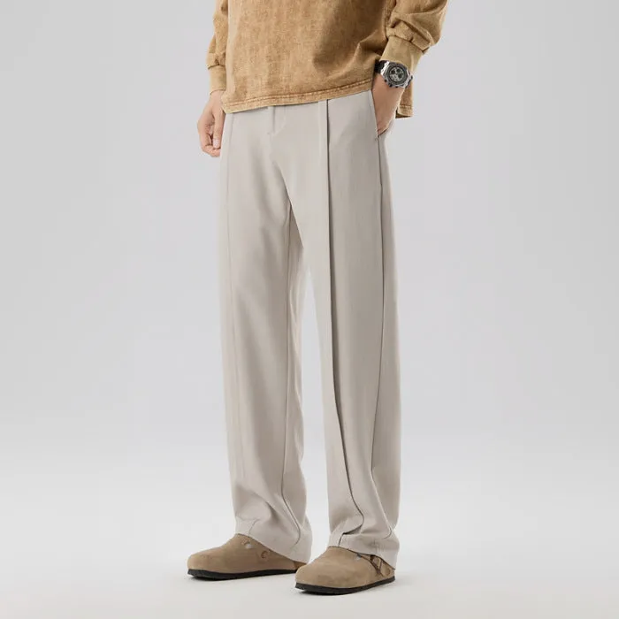 Men's casual loose straight-leg pants in solid colour with mid-high elastic waist and button fly front, available in plus sizes