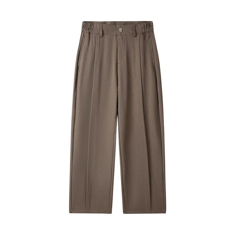 Men's casual loose straight-leg pants in solid colour with mid-high elastic waist and button fly front, available in plus sizes