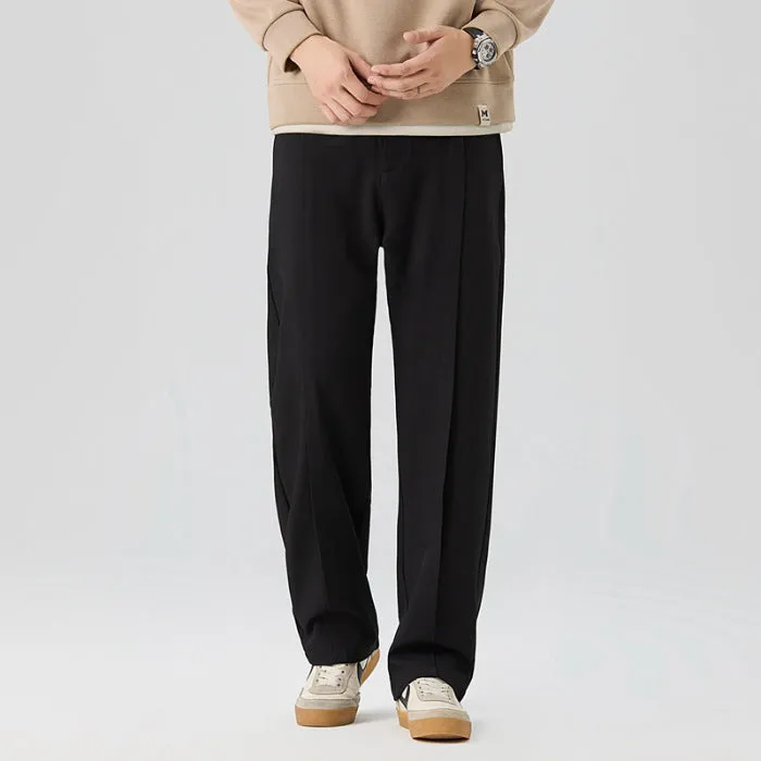 Men's casual loose straight-leg pants in solid colour with mid-high elastic waist and button fly front, available in plus sizes