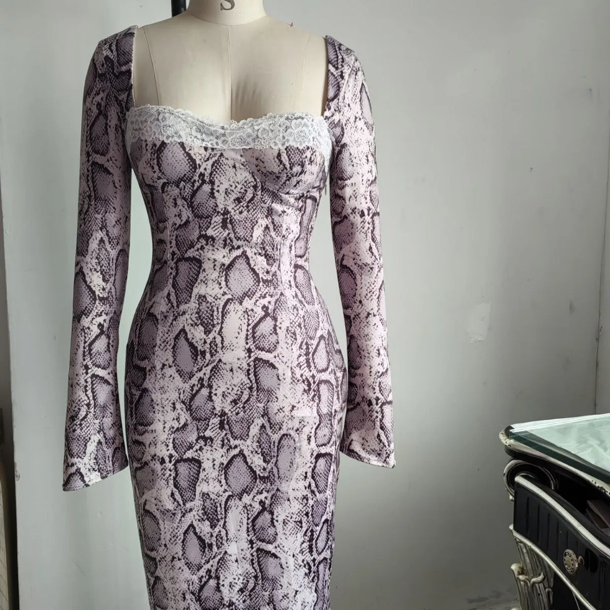Grey slim fit women's lace dress with long sleeves, A-line skirt, and a digital 3D printed pattern.