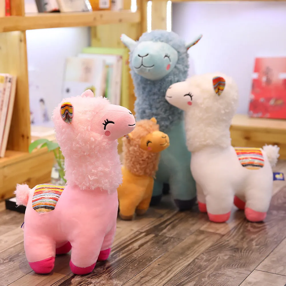 Alpaca llama plush toy in white standing on a surface