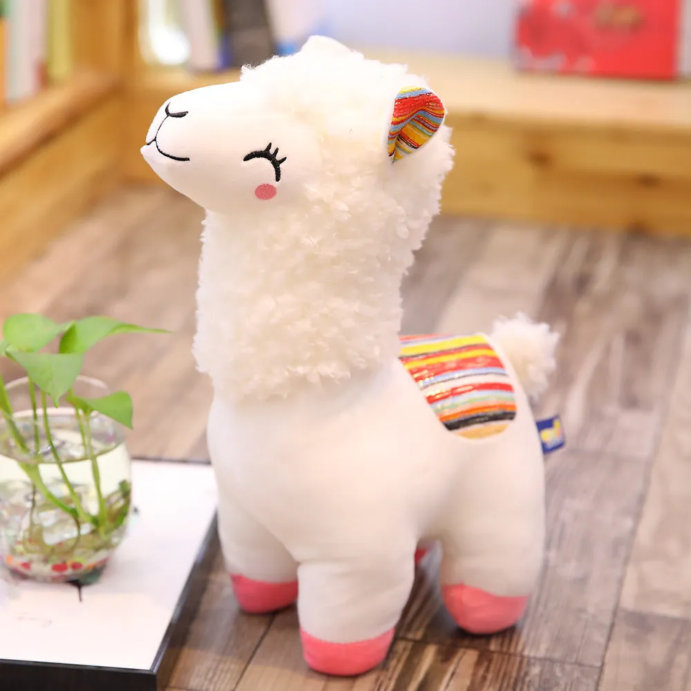 Alpaca llama plush toy in white standing on a surface